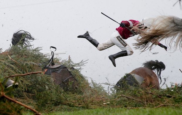 Jockey Nina Carberry flies off her horse Sir Des Champs (left) as they fall at The Chair fence during the Grand National steeplechase, at Aintree Racecourse, Liverpool, UK. Taken on a Canon EOS-1D X with an EF24-70mm f/2.8L II USM lens at 70mm; the exposure was 1/5312sec at f/4, ISO 2000.